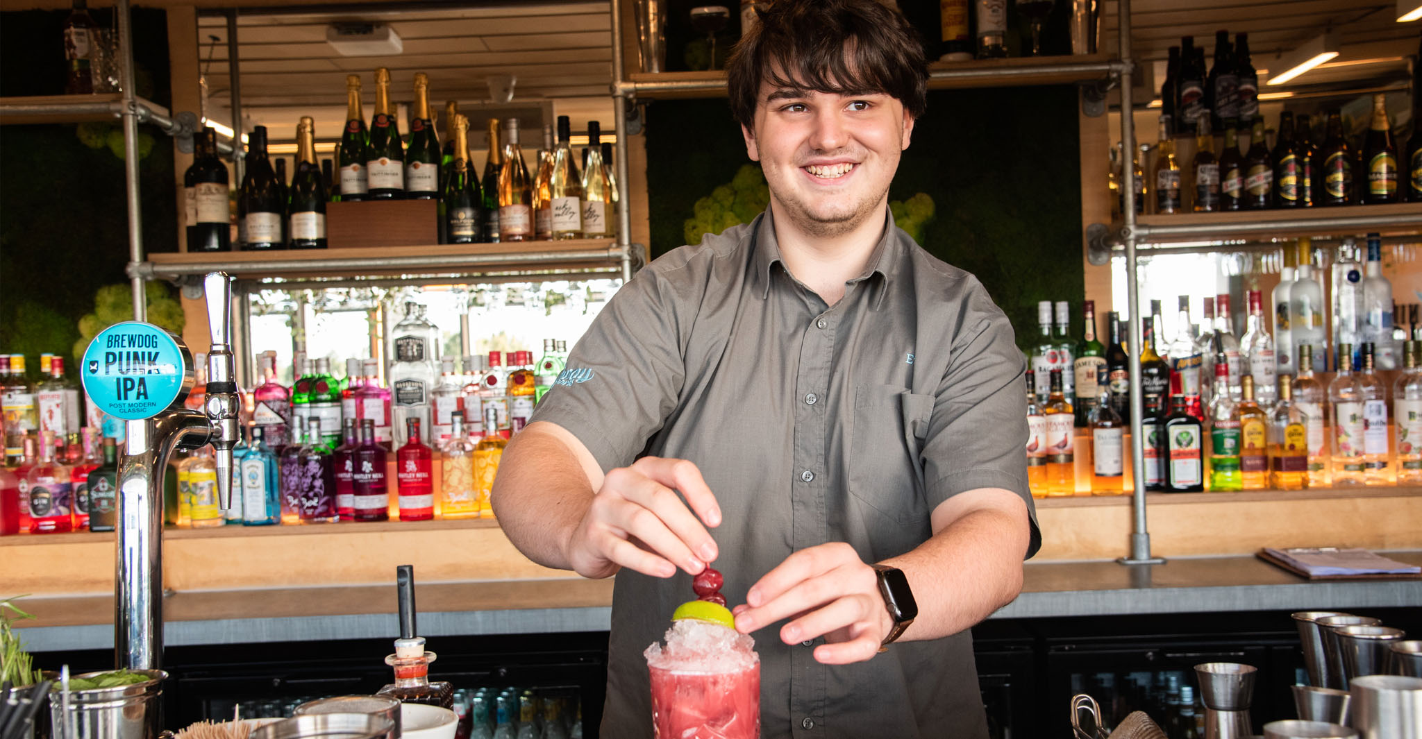 Away Resorts bar team member preparing a drink
